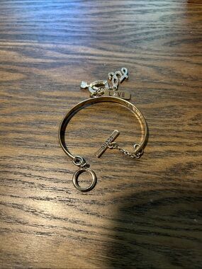 Guess charm bracelet with toggle clasp and dangling charms